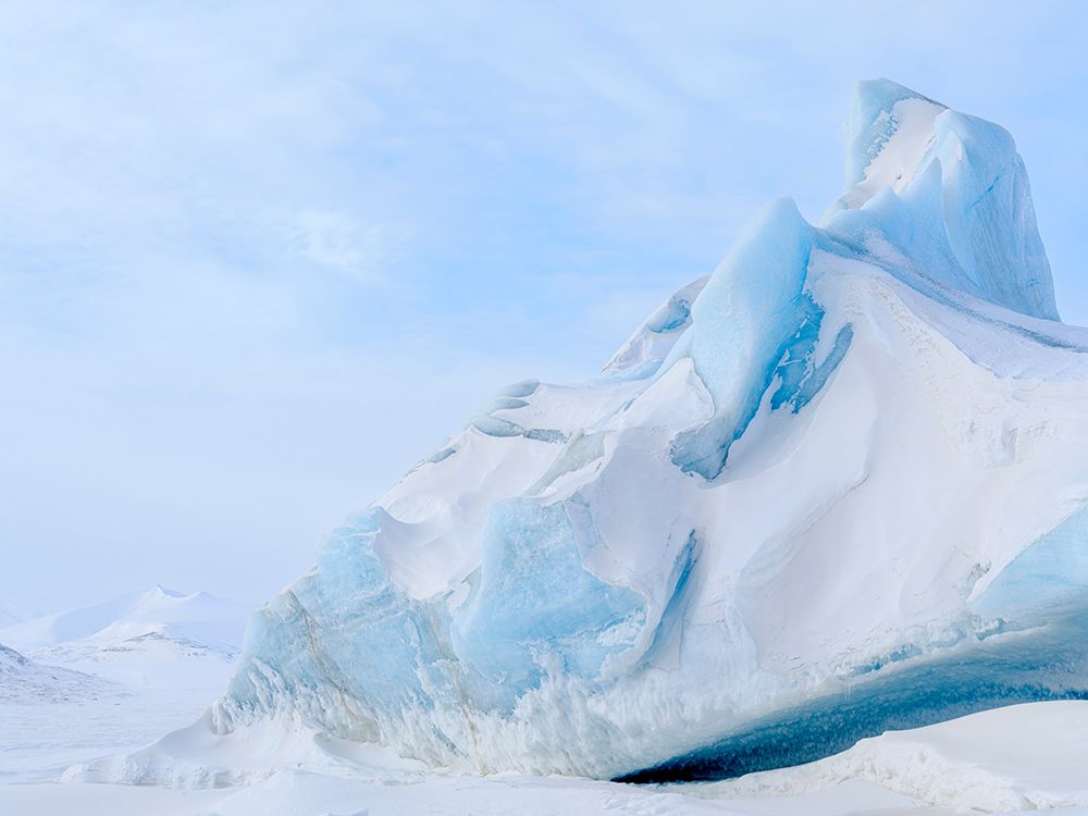 Iceberg in the frozen Mohnbukta in Sabine-Land. Spitzbergen in the Svalbard. Scandinavia, Norway. art print by Martin Zwick for $57.95 CAD