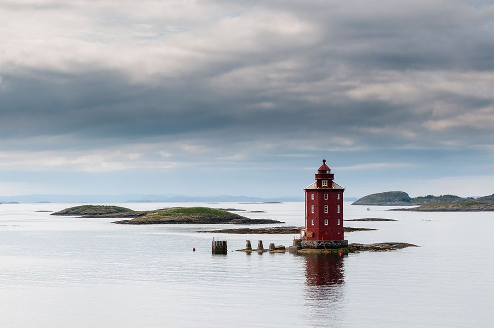Kjeungskjaer lighthouse sits on a small island in the glacial waters of Bjugnfjorden Norway art print by Sergio Pitamitz for $57.95 CAD