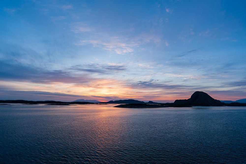 The sun sets beyond silhouetted islands in the Norwegian Sea near Bronnoysund Bronnoy-Norway art print by Sergio Pitamitz for $57.95 CAD