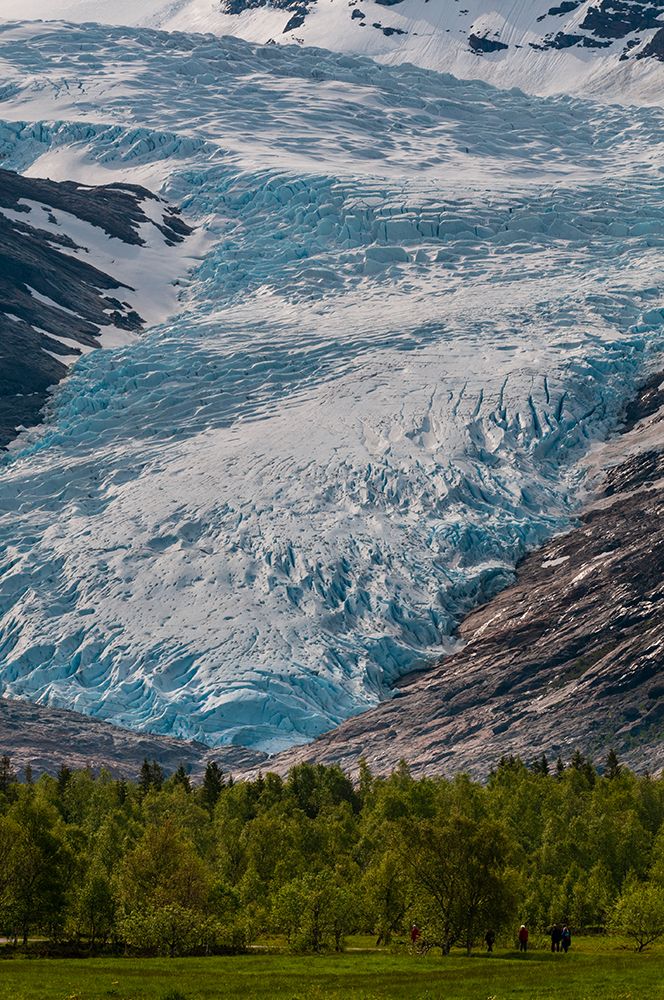 Hikers walk in a verdant valley near the terminus of Svartisen Glacier Svartisen-Norway art print by Sergio Pitamitz for $57.95 CAD