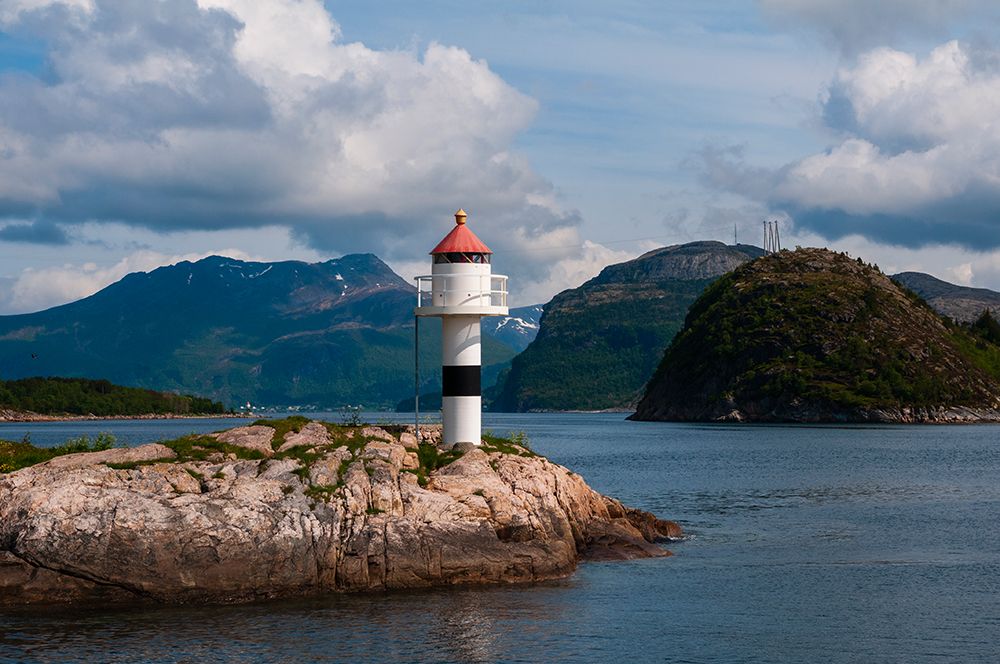 A small lighthouse perched on a rock promontory in Hollandsfjord-Svartisen-Norway art print by Sergio Pitamitz for $57.95 CAD