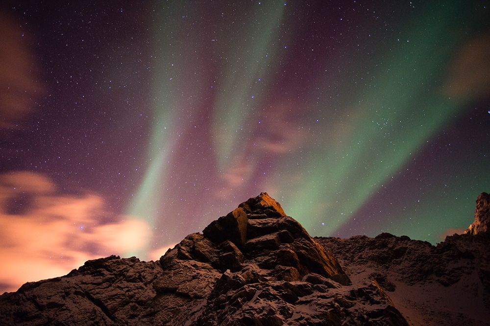 An aurora borealis behind a mountain peak in Andenes Andenes-Vesteralen Islands-Nordland-Norway art print by Sergio Pitamitz for $57.95 CAD
