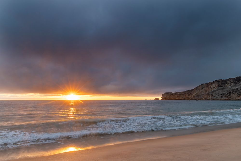 Sunset over the Atlantic Ocean from Nazare, Portugal art print by Chuck Haney for $57.95 CAD