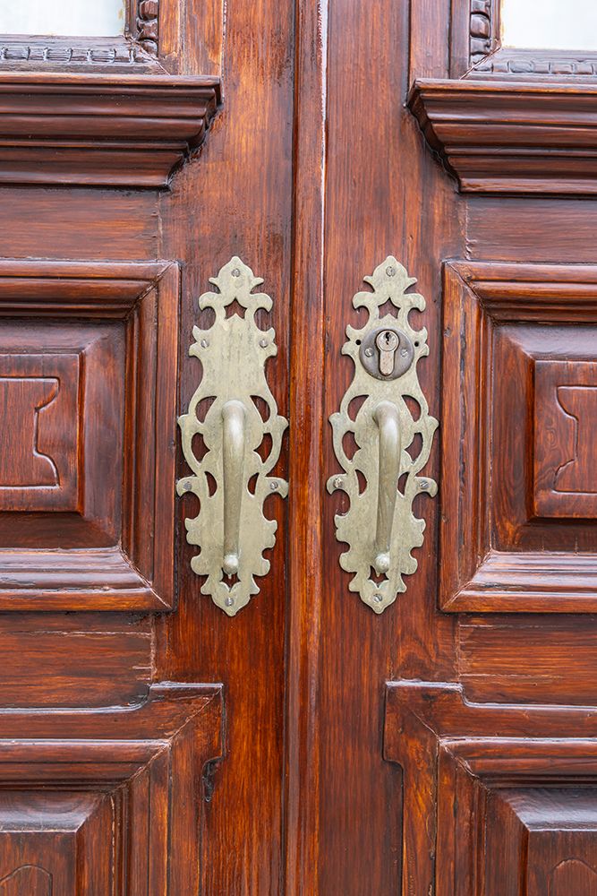 Angra do Heroismo, Terceira Island, Azores, Portugal. Brass handles on old wooden doors. art print by Emily M. Wilson for $57.95 CAD