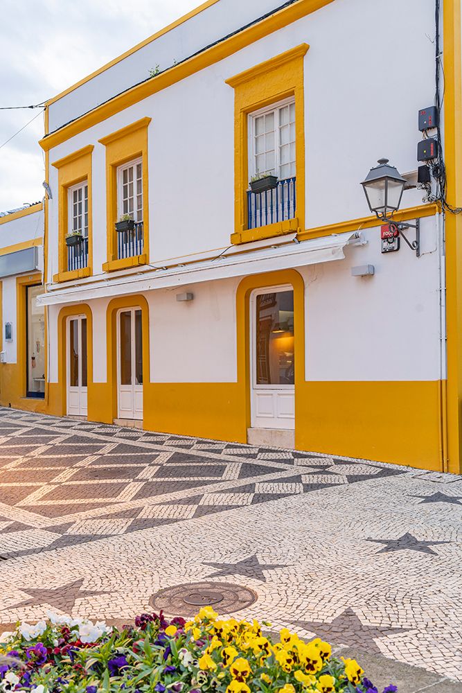 Ponta Delgada, Sao Miguel, Azores, Portugal. Yellow and white building in Ponta Delgada. art print by Emily M. Wilson for $57.95 CAD