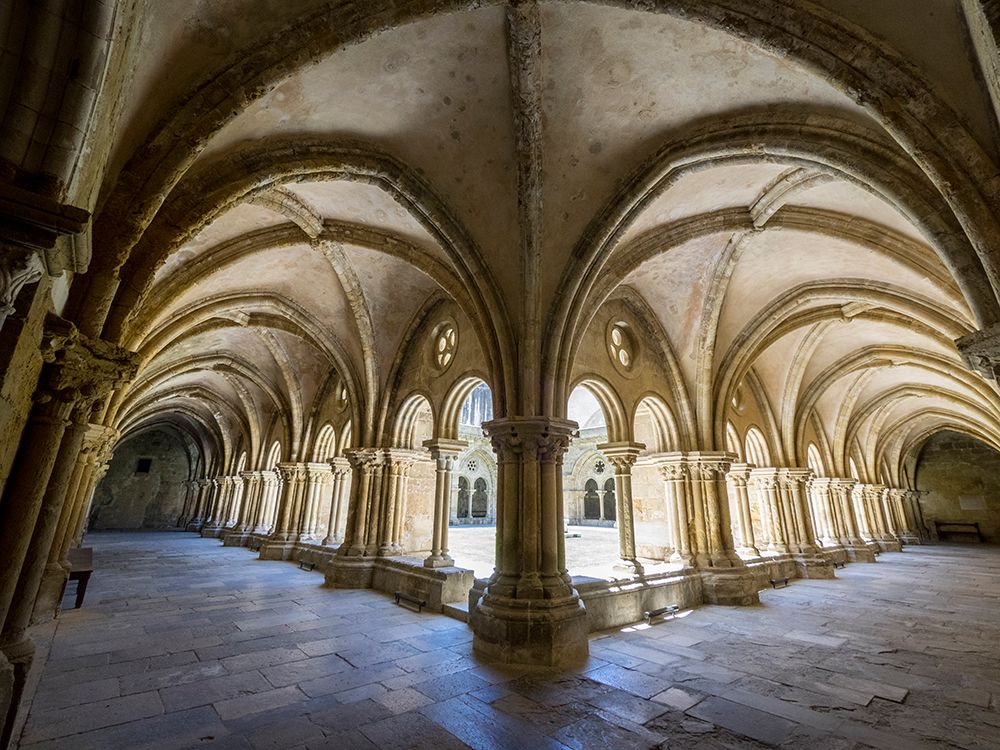 The early 12 century cloister in the old Cathedral (Se Velha) art print by Julie Eggers for $57.95 CAD