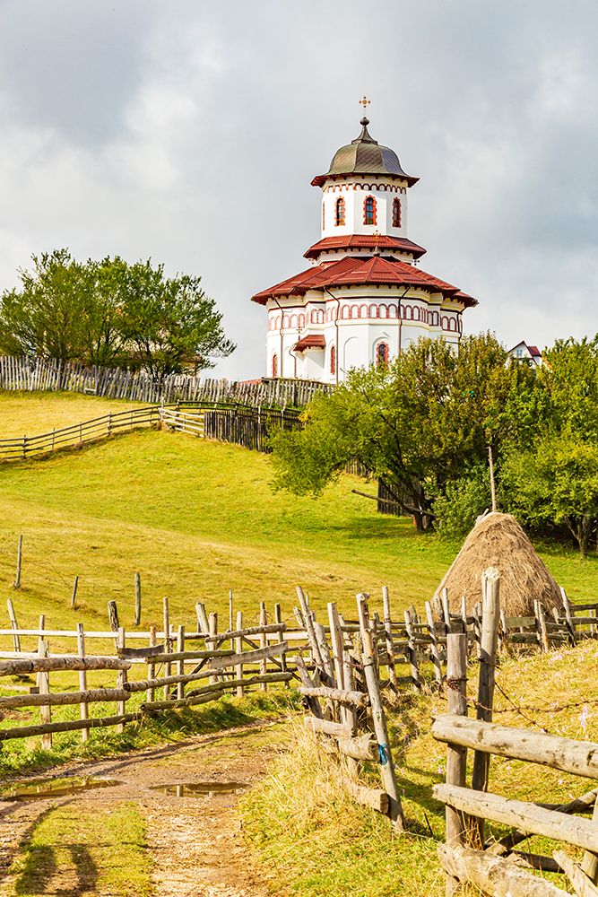 Romania, Transylvania, Carpathian Mountains. Hiking trails, fields. Village church. art print by Emily M. Wilson for $57.95 CAD