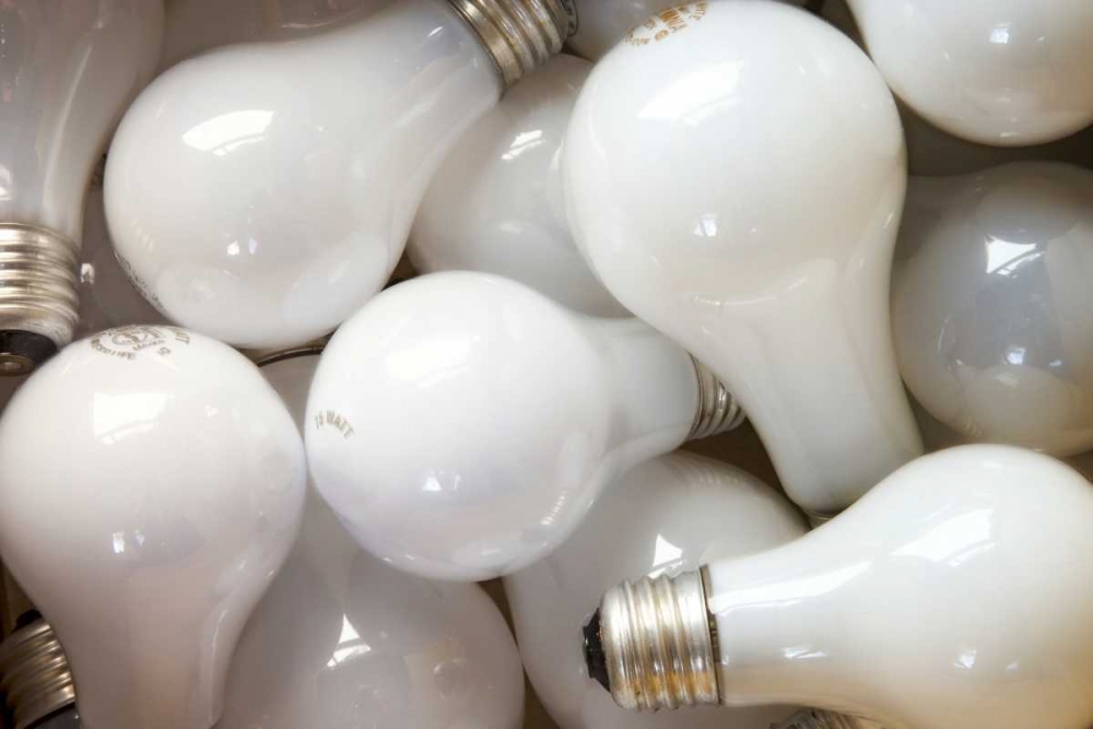 Montage close-up of incandescent light bulbs art print by Don Paulson for $57.95 CAD