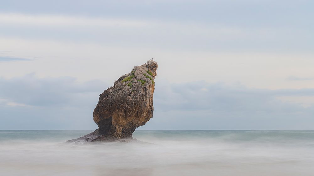 Spain, Playa Buelna. Lone ocean sea stack on misty coastline. art print by Jaynes Gallery for $57.95 CAD