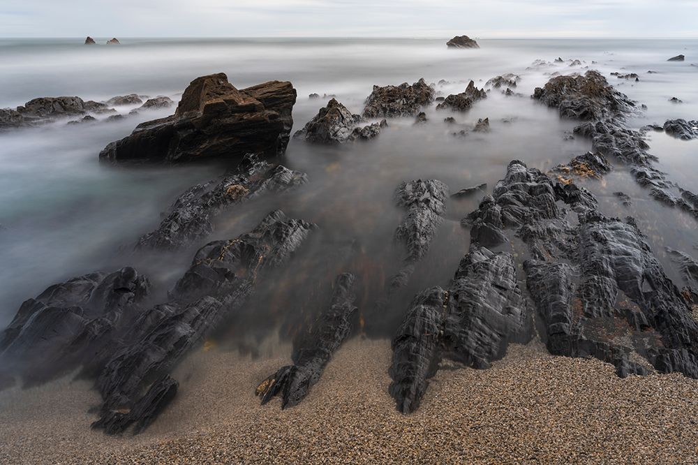 Spain, Playa de Portizuelo. Rock formations on ocean shore. art print by Jaynes Gallery for $57.95 CAD