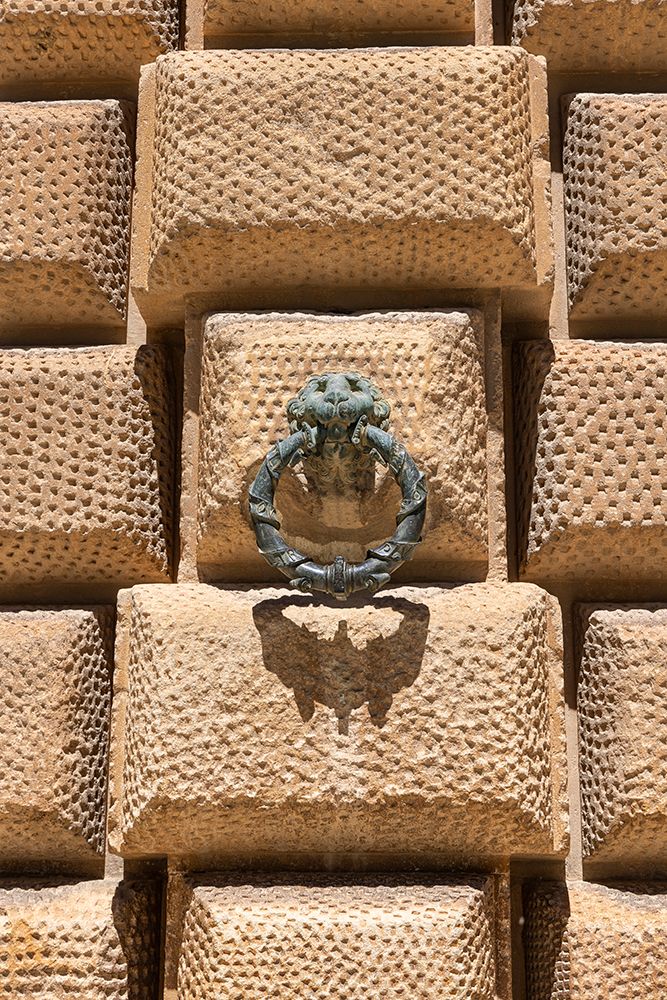 Albaicin, Andalusia, Spain. Bronze hitching loop shape of a lion on a stone wall in the Alhambra. art print by Emily M. Wilson for $57.95 CAD