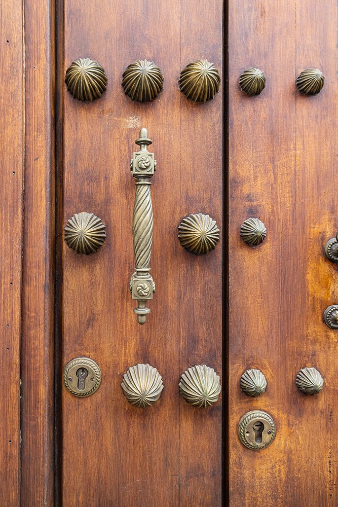 Centro District, Cordoba, Andalusia, Spain. Brass handle and decorations on old Spanish building. art print by Emily M. Wilson for $57.95 CAD