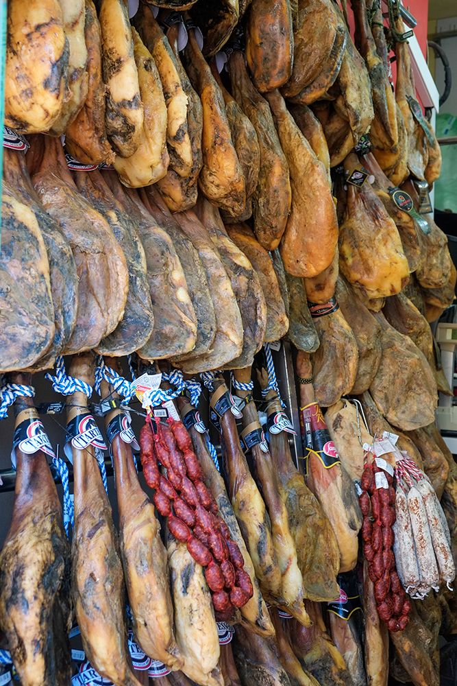 Rhonda, Spain. Legs of Jamon Iberico hanging for sale in local shop. art print by Julien McRoberts for $57.95 CAD