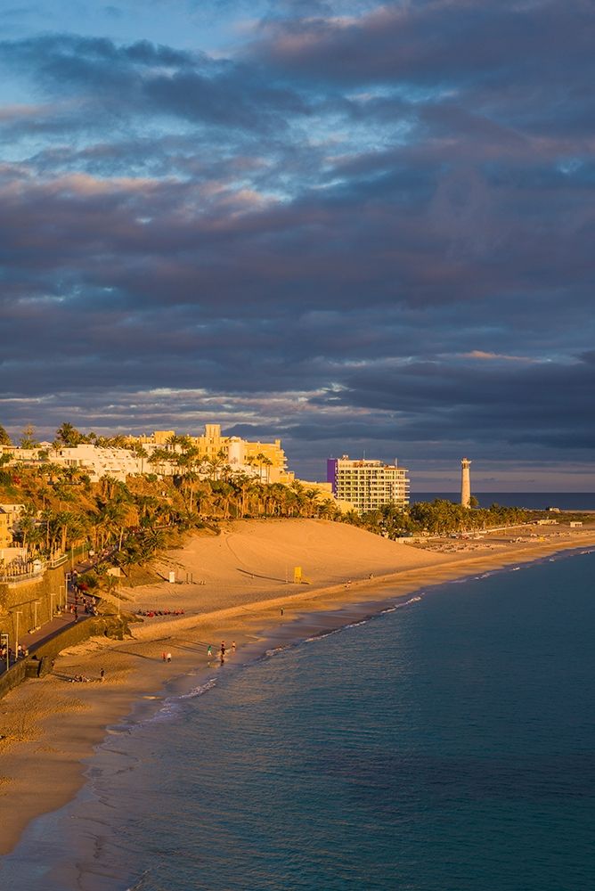 Canary Islands-Fuerteventura Island-Morro Jable-high angle view of Playa de la Cebada beach-sunset art print by Walter Bibikow for $57.95 CAD