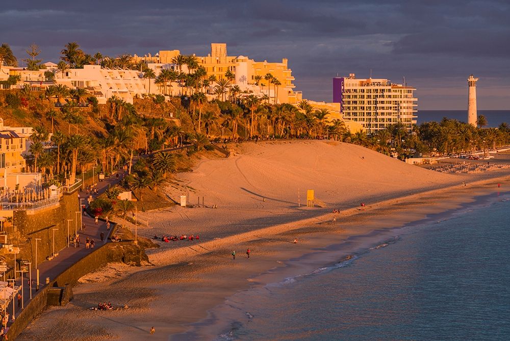 Canary Islands-Fuerteventura Island-Morro Jable-high angle view of Playa de la Cebada beach-sunset art print by Walter Bibikow for $57.95 CAD