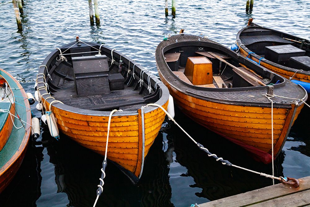 Row of wooden moored small boats, Kyrkbacken, Sweden art print by Rob Casey for $57.95 CAD