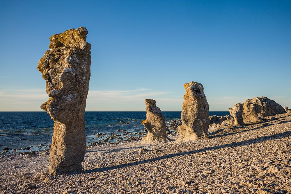 Sweden-Faro Island-Langhammars Area-Langhammar coastal limestone rauk rock-sunset art print by Walter Bibikow for $57.95 CAD