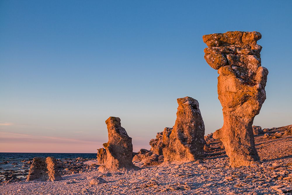 Sweden-Faro Island-Langhammars Area-Langhammar coastal limestone rauk rock-sunset art print by Walter Bibikow for $57.95 CAD