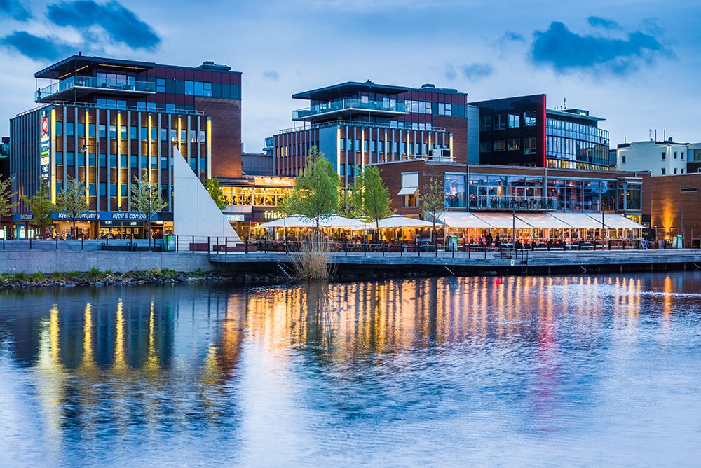 Sweden-Lake Vattern Area-Jonkoping-renovated harbor area along Munksjon Bay-dusk art print by Walter Bibikow for $57.95 CAD