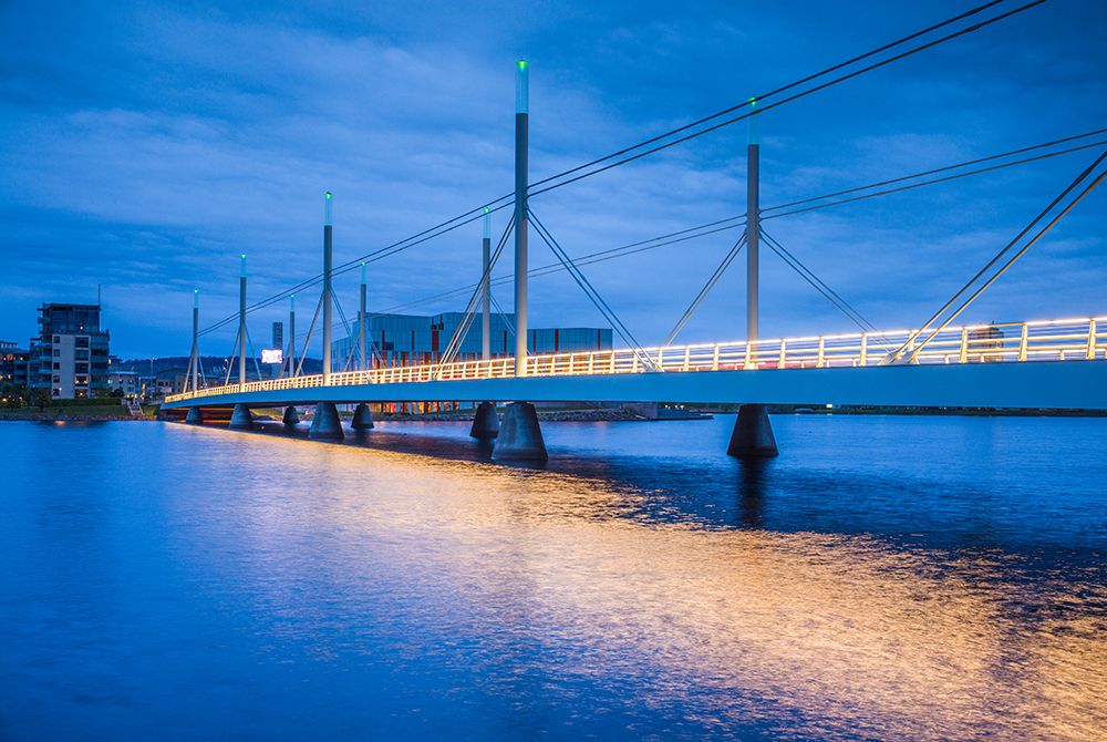 Sweden-Lake Vattern Area-Jonkoping-Munksjon Bay Bridge-dusk art print by Walter Bibikow for $57.95 CAD
