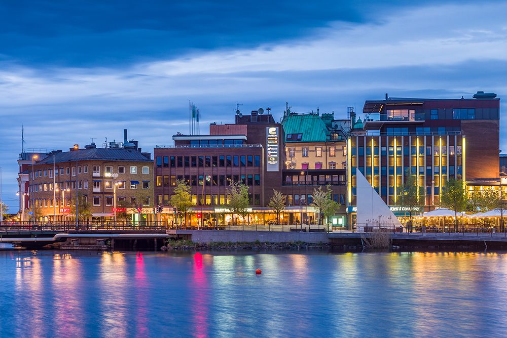 Sweden-Lake Vattern Area-Jonkoping-renovated harbor area along Munksjon Bay-dusk art print by Walter Bibikow for $57.95 CAD