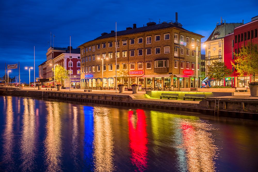 Sweden-Lake Vattern Area-Jonkoping-renovated harbor area along Munksjon Bay-dusk art print by Walter Bibikow for $57.95 CAD