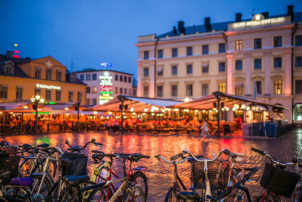 Sweden-Linkoping-cafes and bars on Stora target square-dusk art print by Walter Bibikow for $57.95 CAD