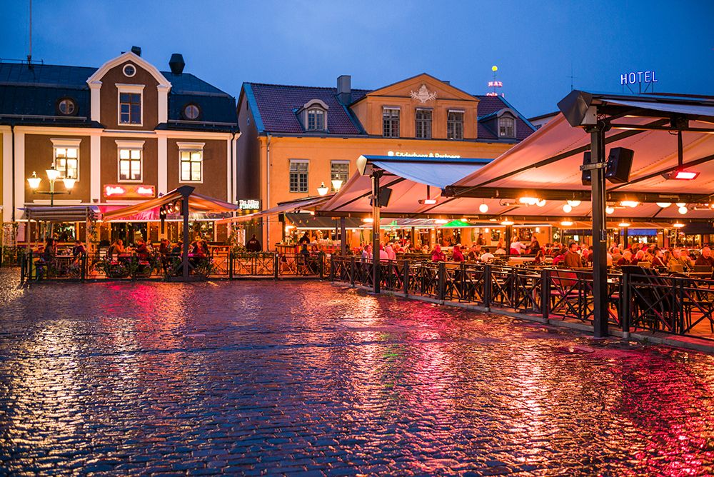 Sweden-Linkoping-cafes and bars on Stora target square-dusk art print by Walter Bibikow for $57.95 CAD