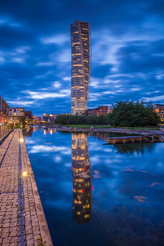 Sweden-Scania-Malmo-Turning Torso building-designed by architect Santiago Calatrava-2005-dusk art print by Walter Bibikow for $57.95 CAD