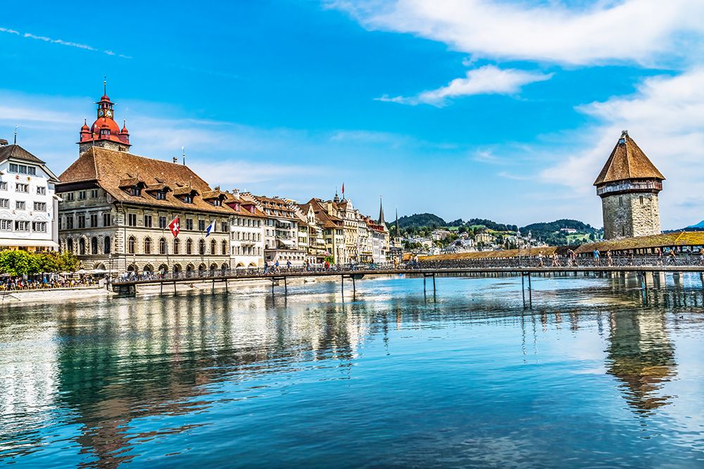 Inner harbor restaurants-and shops-Lucerne-Switzerland. Built in 1365. art print by William Perry for $57.95 CAD