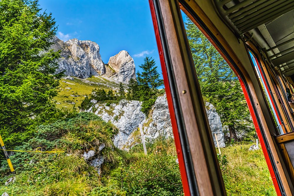 Colorful cogwheel rail car climbing Mount Pilatus-Lucerne-Switzerland. art print by William Perry for $57.95 CAD