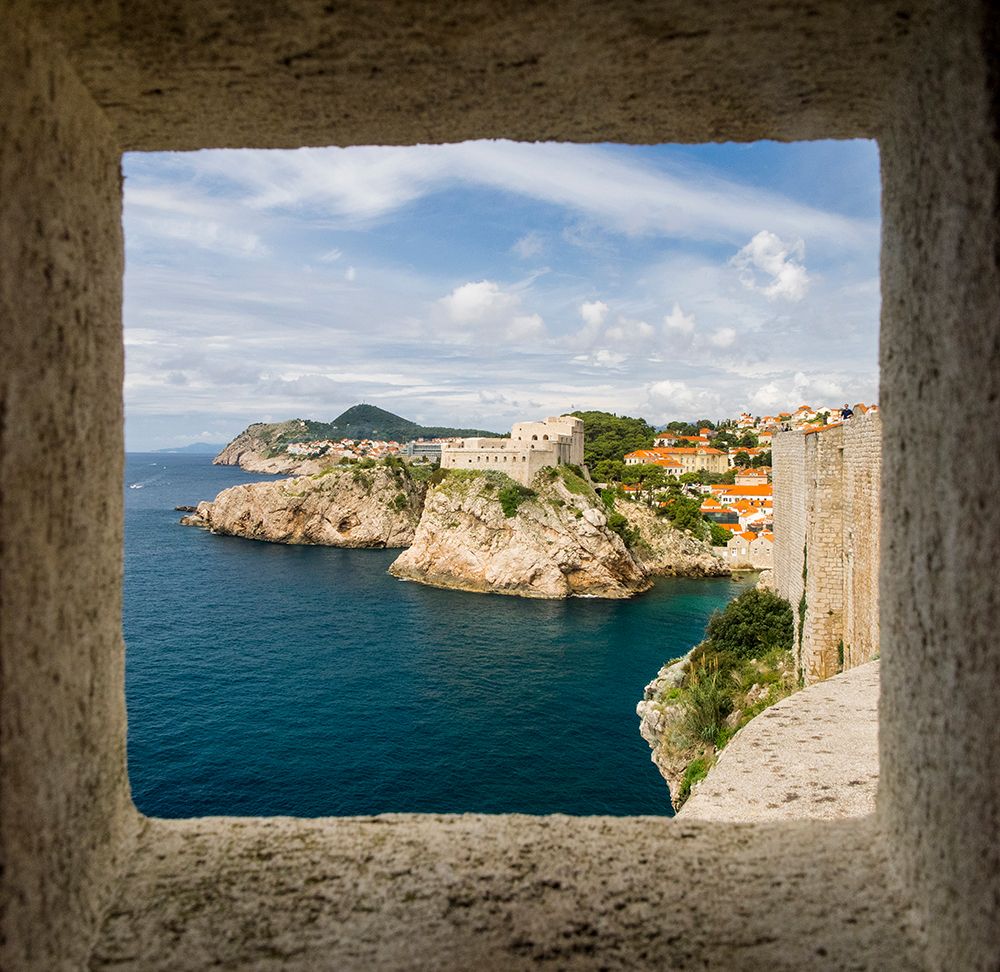 Croatia-Dubrovnik. Ancient fortress on the cliff edge of Dubrovnik protects the port. art print by Julie Eggers for $57.95 CAD