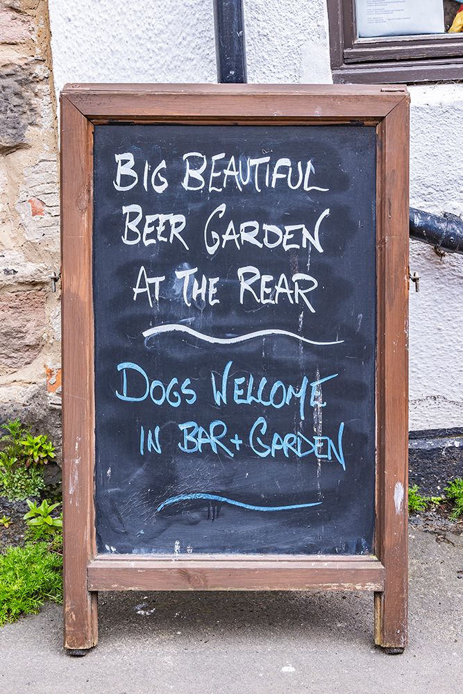 Lindisfarne, Holy Island, Berwick-upon-Tweed, Northumberland, England. Chalkboard sign outside pub. art print by Emily M. Wilson for $57.95 CAD