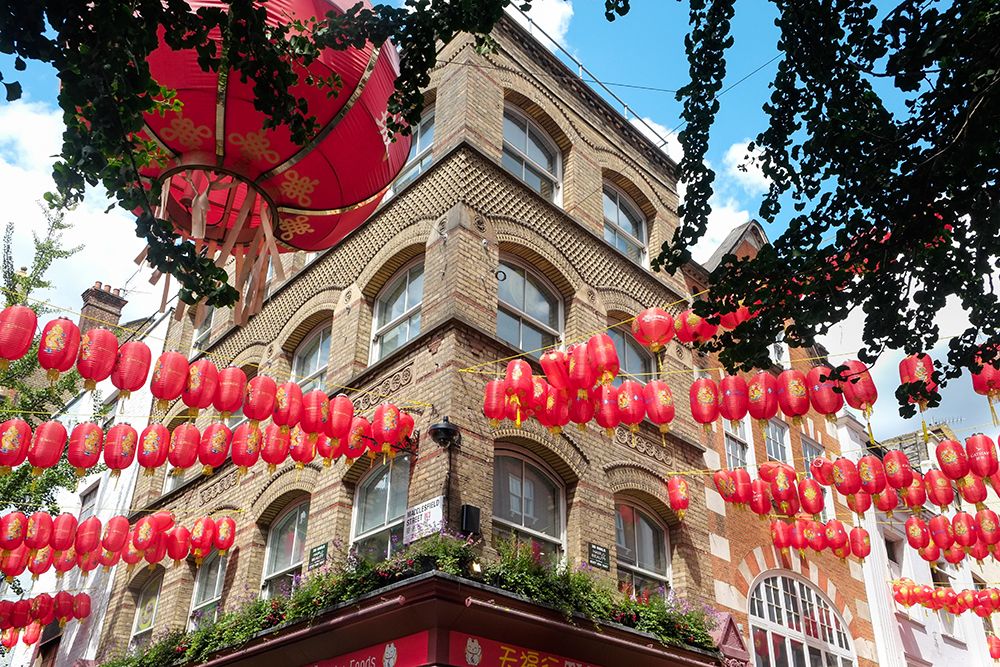 London, England, UK. Chinatown district. Red lanterns, old phone booths and souvenirs are found. art print by Julien McRoberts for $57.95 CAD
