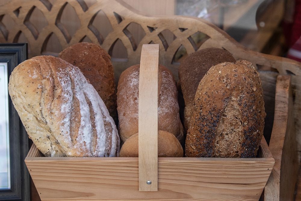 Basket of breads was found sitting on a bench outside a bakery in Glastonbury-England art print by Mallorie Ostrowitz for $57.95 CAD