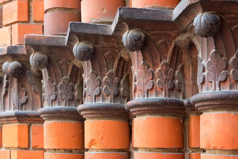 Carved red columns in the old town-Riga-Latvia art print by Keren Su for $57.95 CAD