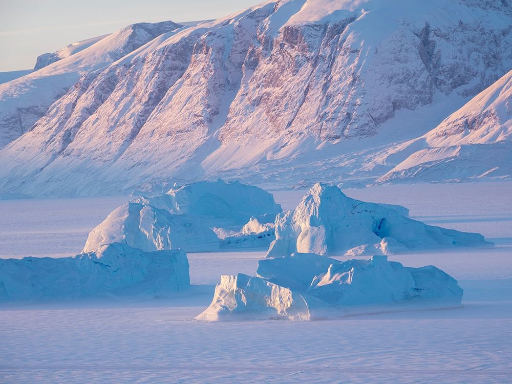 Icebergs frozen into the sea ice of the Uummannaq Fjord System during winter art print by Martin Zwick for $57.95 CAD