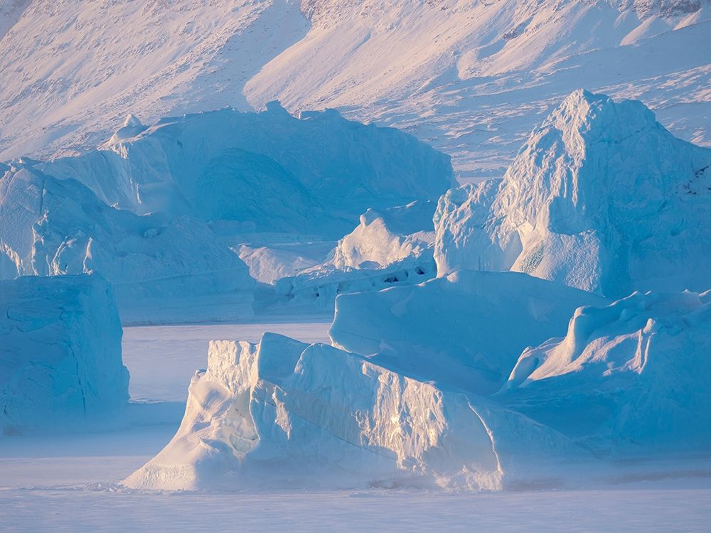 Icebergs frozen into the sea ice of the Uummannaq Fjord System during winter art print by Martin Zwick for $57.95 CAD