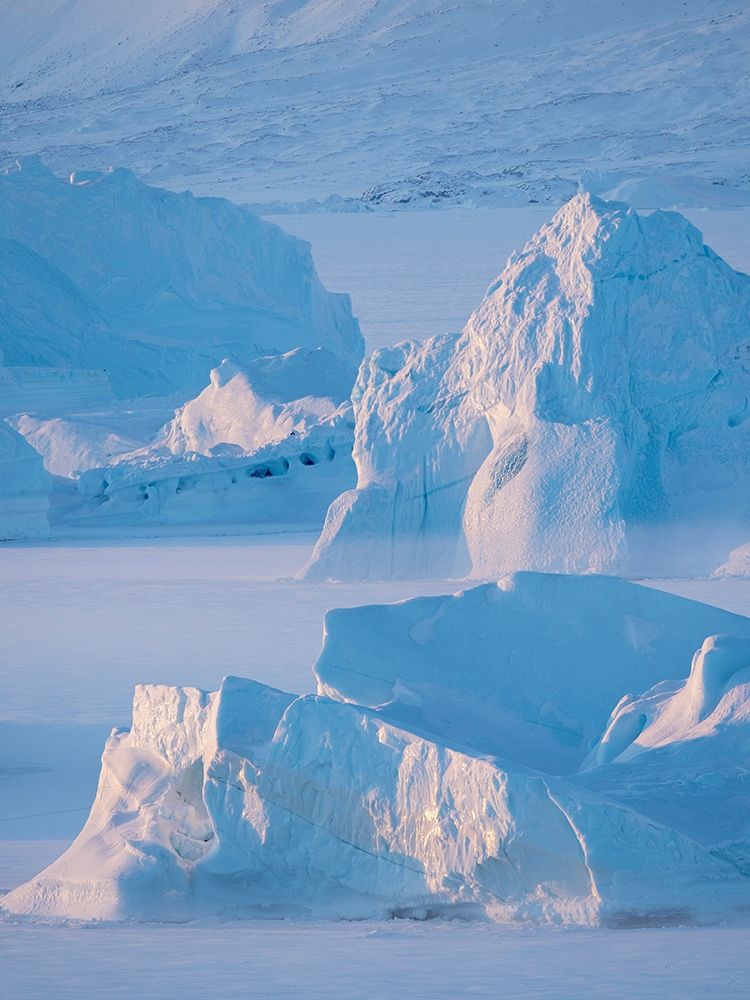 Icebergs frozen into the sea ice of the Uummannaq Fjord System during winter art print by Martin Zwick for $57.95 CAD