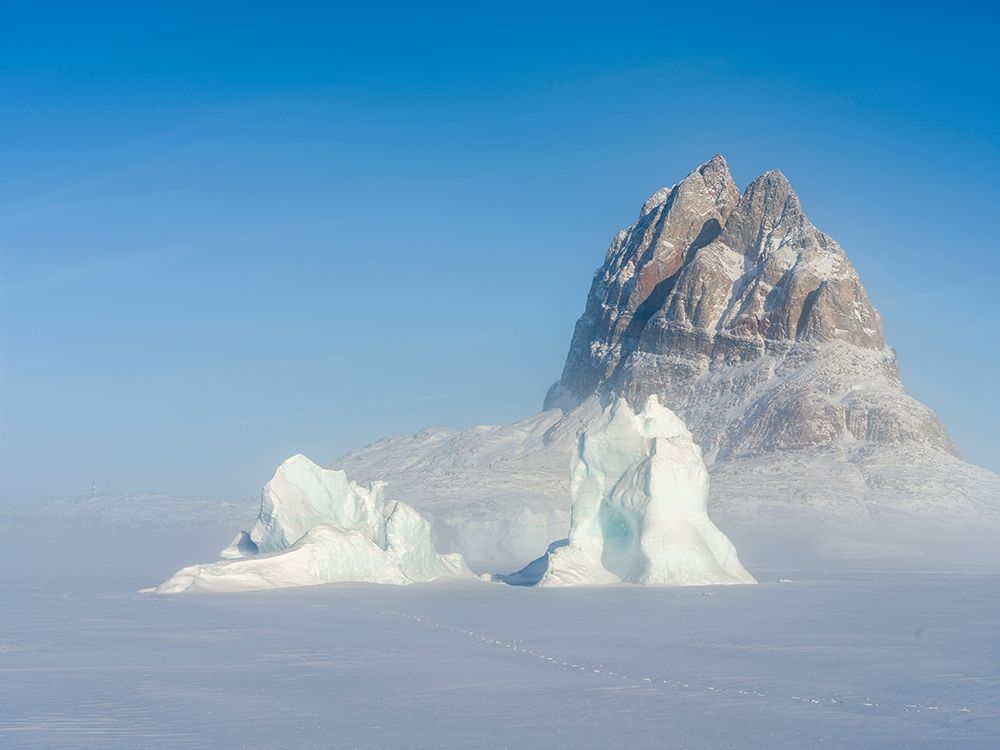Icebergs frozen into the sea ice of the Uummannaq Fjord System during winter art print by Martin Zwick for $57.95 CAD
