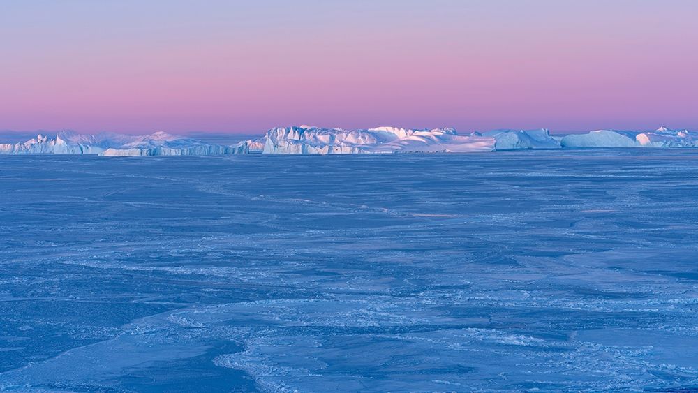 Sunrise during winter at the Ilulissat Fjord-located in the Disko Bay in West Greenland art print by Martin Zwick for $57.95 CAD