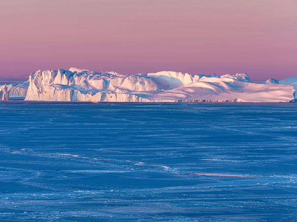 Sunrise during winter at the Ilulissat Fjord-located in the Disko Bay in West Greenland art print by Martin Zwick for $57.95 CAD