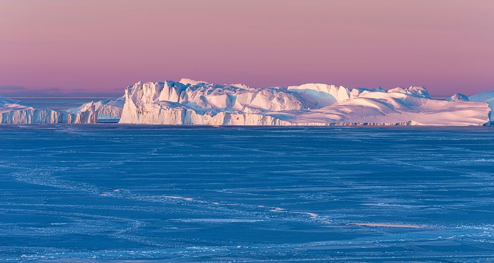 Sunrise during winter at the Ilulissat Fjord-located in the Disko Bay in West Greenland art print by Martin Zwick for $57.95 CAD