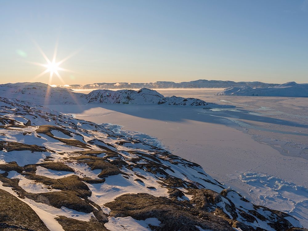 Sunrise during winter at the Ilulissat Icefjord-located in the Disko Bay in West Greenland art print by Martin Zwick for $57.95 CAD