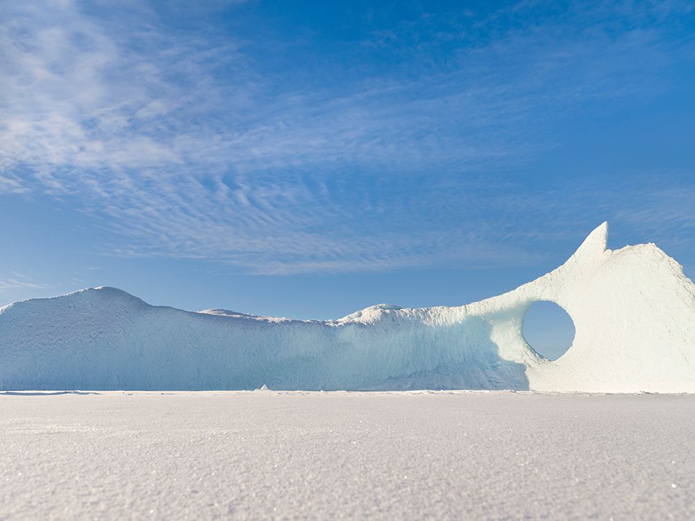 Iceberg frozen into the sea ice of the Uummannaq fjord system during winter-Greenland-Danish Territ art print by Martin Zwick for $57.95 CAD
