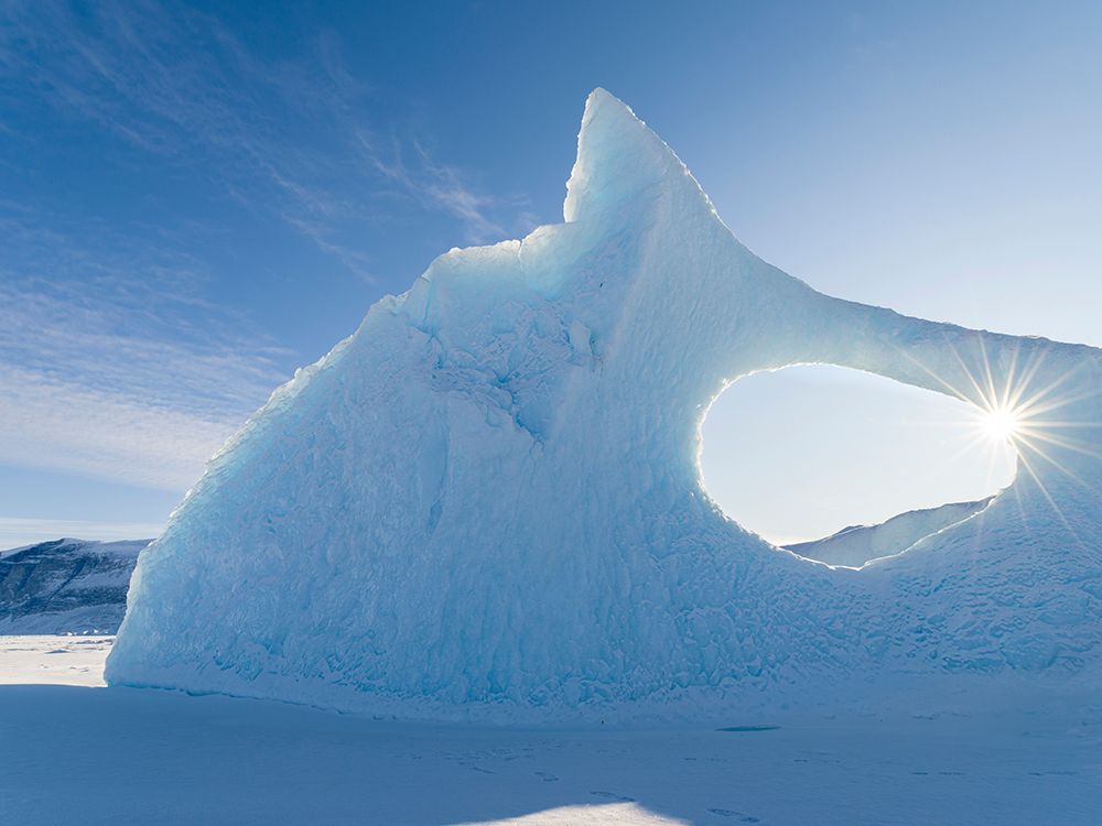 Iceberg frozen into the sea ice of the Uummannaq fjord system during winter-Greenland-Danish Territ art print by Martin Zwick for $57.95 CAD