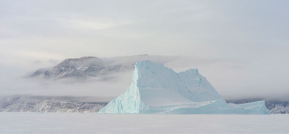 Icebergs in front of Storen Island-frozen into the sea ice of the Uummannaq fjord system during win art print by Martin Zwick for $57.95 CAD