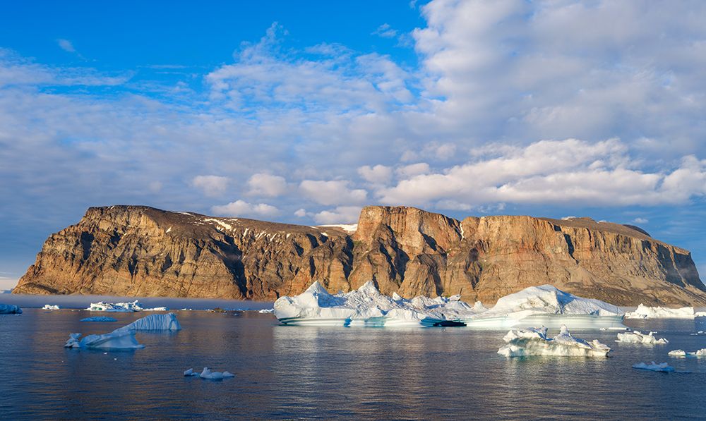 Midnight sun at Storoen Island. Uummannaq Fjord, northwest of Greenland beyond the arctic circle. art print by Martin Zwick for $57.95 CAD