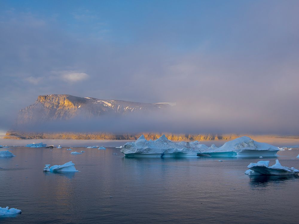Midnight sun at Storoen Island. Uummannaq Fjord, northwest of Greenland beyond the arctic circle. art print by Martin Zwick for $57.95 CAD