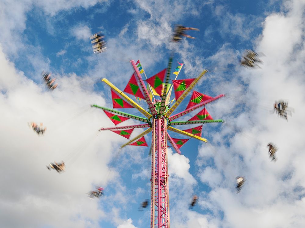 Motion blur of Swing (or Chair Swing) ride at a fair. art print by Merrill Images for $57.95 CAD